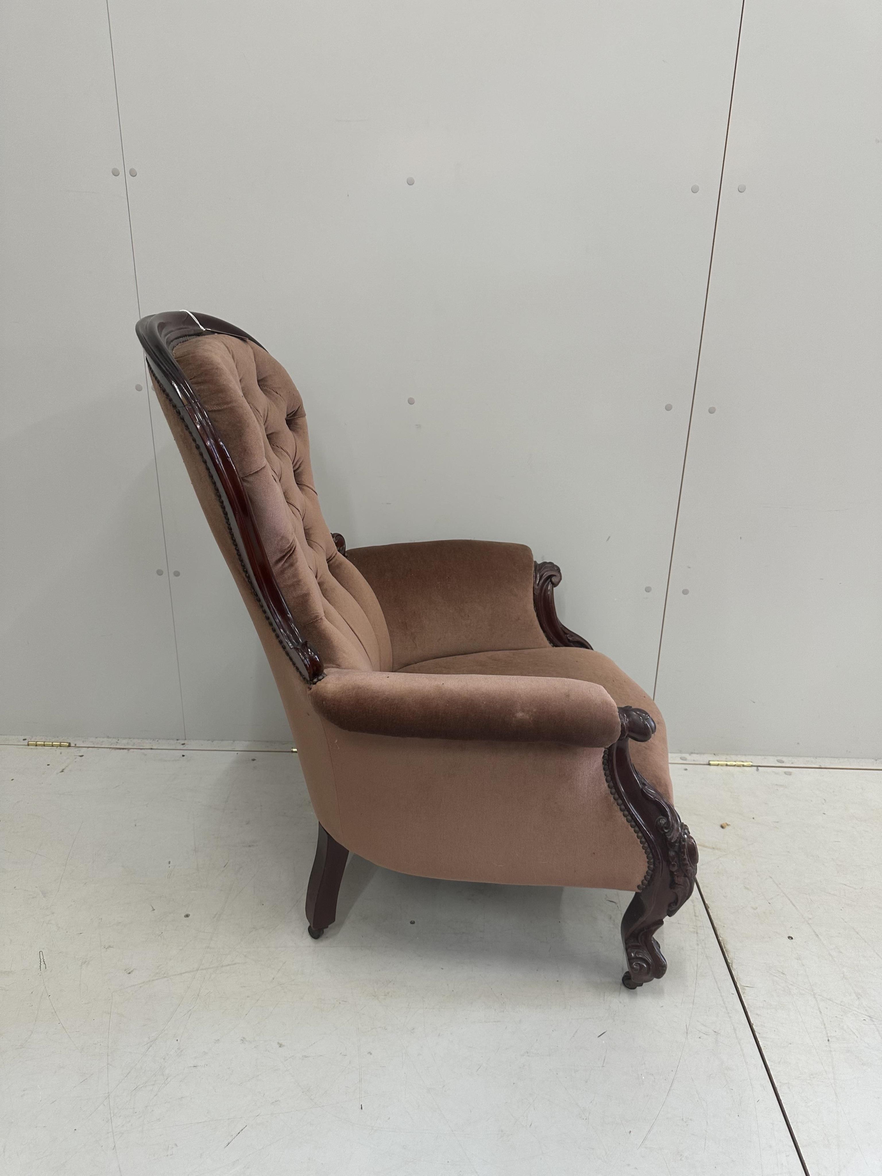 A Victorian upholstered mahogany spoonback armchair, width 80cm, depth 70cm, height 108cm. Condition - fair